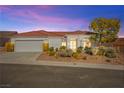 Charming single-story home with a red tile roof, desert landscaping, and a two-car garage at 10920 Grand Haven Ave, Las Vegas, NV 89134