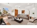 Bright living room with wood floors, high ceilings and a large picture window allowing ample natural light at 10920 Grand Haven Ave, Las Vegas, NV 89134