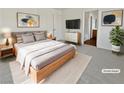 Virtually staged main bedroom with light wood furniture and neutral decor at 3615 American Pie Ct, Las Vegas, NV 89129