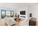 Spacious living area with hardwood floors and sliding glass doors at 394 Solitude Peak Ln, Henderson, NV 89012