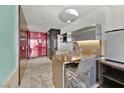 Sleek kitchen with wood breakfast bar and stainless steel finishes at 4381 W Flamingo Rd # 3519, Las Vegas, NV 89103