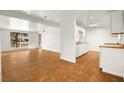 Open living room with tile flooring and natural light at 4520 Harmon Cir, Las Vegas, NV 89122