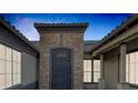 Ornate iron gate leading to a private area of the home at 6336 San Gagano Ave, Las Vegas, NV 89131