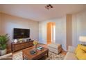 Spacious living room featuring hardwood floors and ample natural light at 10484 Beautiful Fruit St, Las Vegas, NV 89183