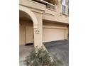 Townhome entryway with arched entry and attached garage at 10550 W Alexander Rd # 2082, Las Vegas, NV 89129