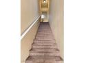 Indoor carpeted staircase leading to the second floor at 10550 W Alexander Rd # 2082, Las Vegas, NV 89129