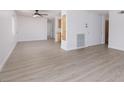 Bright living room featuring light wood-look vinyl flooring at 1105 I, Boulder City, NV 89005