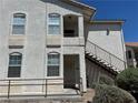 Exterior view of a light colored stucco building with stairs at 1405 S Nellis Blvd # 1090, Las Vegas, NV 89104