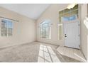 Bright living room with high ceilings and large windows at 1614 Redhawk Ct, Henderson, NV 89074