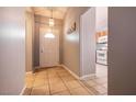 Bright entryway with tiled floors and a view into the kitchen at 2535 River Oaks Dr, Las Vegas, NV 89156