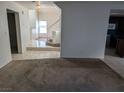 Living room with carpet and view of staircase at 2849 Huber Heights Dr, Las Vegas, NV 89128