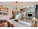 Spacious dining area with a chandelier and farmhouse-style table at 3402 Arcata Point Ave, Las Vegas, NV 89141