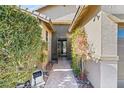 Welcoming entryway with a paved walkway and lush greenery at 3801 Terrace Grove St, Las Vegas, NV 89129