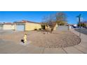 House exterior view with a rock landscaping and a fire hydrant at 451 Wright Way, Henderson, NV 89015