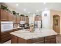 Spacious kitchen with granite island and stainless steel appliances at 493 Lace Haven Ct, Henderson, NV 89012