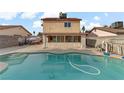 Home with a refreshing blue swimming pool in the backyard at 513 Chandler St, Henderson, NV 89014