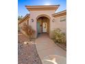 Covered entryway with arched walkway and access to the front door at 526 Highland View Ct, Mesquite, NV 89027