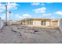 Large backyard area, mostly unlandscaped, ready for personalization at 6205 Hargrove Ave, Las Vegas, NV 89107