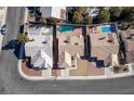 Bird's-eye view of houses with swimming pools in a residential area at 7528 Pinto Bluff St, Las Vegas, NV 89131