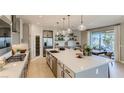 Spacious kitchen featuring a large island, stainless steel appliances, and ample cabinet space at 9268 Copernicus Ave, Las Vegas, NV 89143