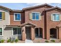 Modern townhome featuring a welcoming front entrance and landscaping at 965 Nevada State Dr # 15103, Henderson, NV 89002