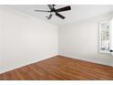 Bright bedroom featuring hardwood floors and a ceiling fan at 9741 Horizon Hills Dr, Las Vegas, NV 89117