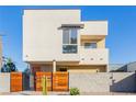 Modern home with wood fence and desert landscaping at , Las Vegas, NV 89104