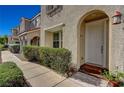 Front entry with walkway, landscaping, and a white door at 1032 Campo Seco Ct, Las Vegas, NV 89138