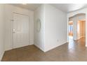 Bright entryway with tile flooring and neutral-colored walls at 10957 Civiletti St, Las Vegas, NV 89141