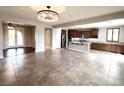 Open concept living room with kitchen and dining area views at 12133 Vista Linda Ave, Las Vegas, NV 89138