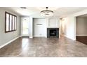 Open concept living area with fireplace and tile floors at 12133 Vista Linda Ave, Las Vegas, NV 89138