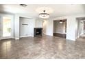 Bright living room featuring a fireplace and large windows at 12133 Vista Linda Ave, Las Vegas, NV 89138