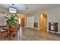 Bright dining area with hardwood floors and a view to the living room at 1248 Abadan St, Las Vegas, NV 89142