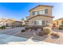 Two-story house with gray shutters, landscaping, and a driveway at 1413 Fantastic Ct, North Las Vegas, NV 89081