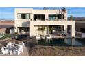 Luxury home with a large pool, outdoor seating, and a hot tub at 168 Still Shores St, Henderson, NV 89011