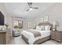 Cozy main bedroom with a queen bed, neutral walls, ceiling fan, and a bright window at 2851 S Valley View Blvd # 1195, Las Vegas, NV 89102