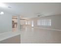 Open living space with tile floors and a view of the kitchen at 2951 Maffie St, Henderson, NV 89052
