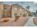 Exterior shot of condo building with low maintenance landscaping at 2983 Juniper Hills Blvd # 102, Las Vegas, NV 89142