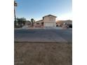 Two-story house with attached garage and a yard at 4079 E Saint Louis Ave, Las Vegas, NV 89104