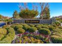 The Gardens community entrance with landscaping and stonework at 7943 Harbour Towne Ave, Las Vegas, NV 89113