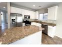 Kitchen with granite countertops and stainless steel appliances at 968 Lucky Bamboo Dr, Henderson, NV 89052