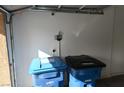 Garage with trash and recycling bins at 10264 Headrick Dr, Las Vegas, NV 89166