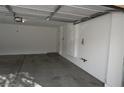 Spacious garage with painted walls and concrete floor at 10264 Headrick Dr, Las Vegas, NV 89166