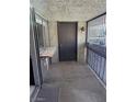 Small patio with a door and a metal railing at 1405 Vegas Valley Dr # 398, Las Vegas, NV 89169