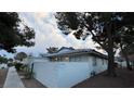 View of home's exterior, showing walkway and landscaping at 2136 Chertsey Dr # A, Las Vegas, NV 89108