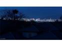 Stunning nighttime view of the city skyline from the property at 2214 Brighton Point Ave, Henderson, NV 89044