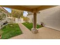 Covered patio with artificial turf and walkway at 2400 Stadler Ct, Las Vegas, NV 89134