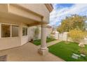 Covered patio with columns and access to the front yard at 2400 Stadler Ct, Las Vegas, NV 89134