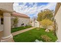 Landscaped front yard with artificial turf and walkway at 2400 Stadler Ct, Las Vegas, NV 89134