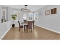 Charming dining room with a round table and four chairs at 2505 Cockatiel Dr, North Las Vegas, NV 89084